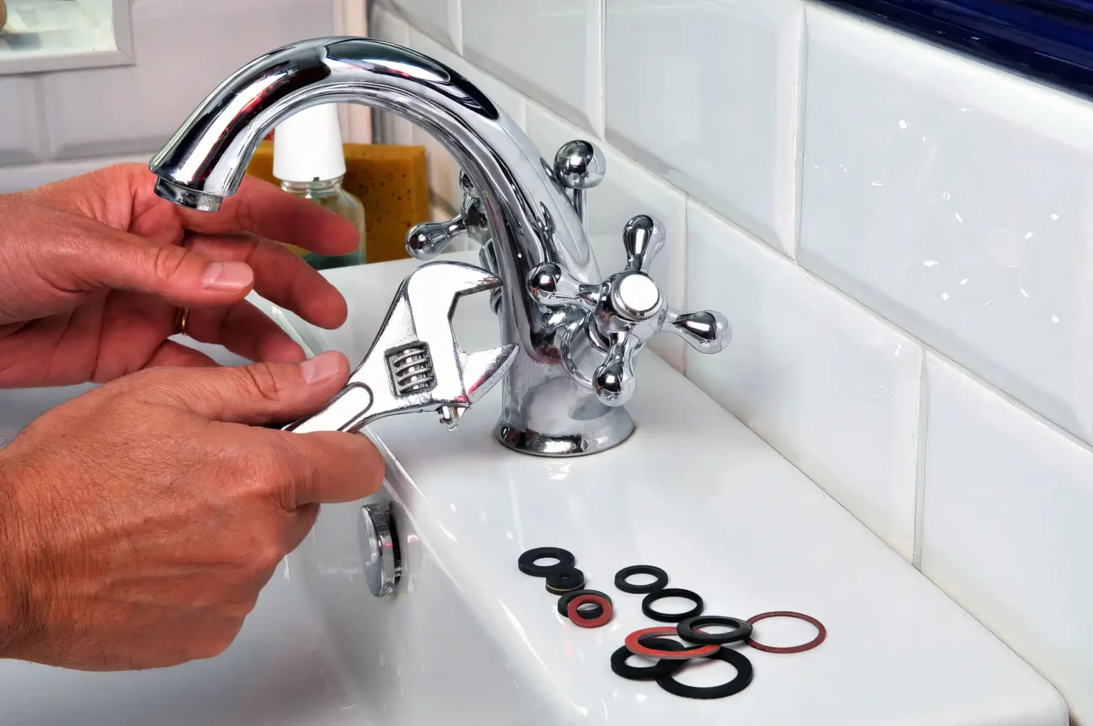 Plumber maintaining a bathroom faucet in Dublin