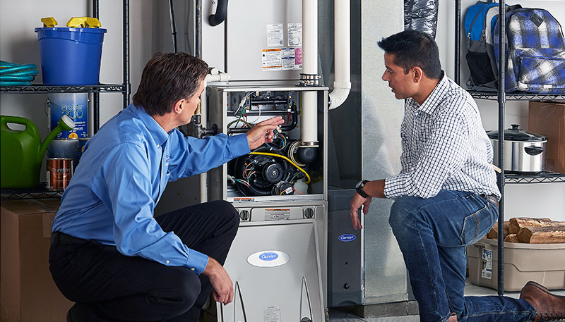 Technician evaluating a furnace for repair or replacement in Dublin