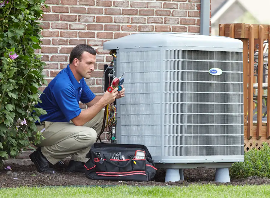HVAC technician inspecting an outdoor AC unit in Dublin