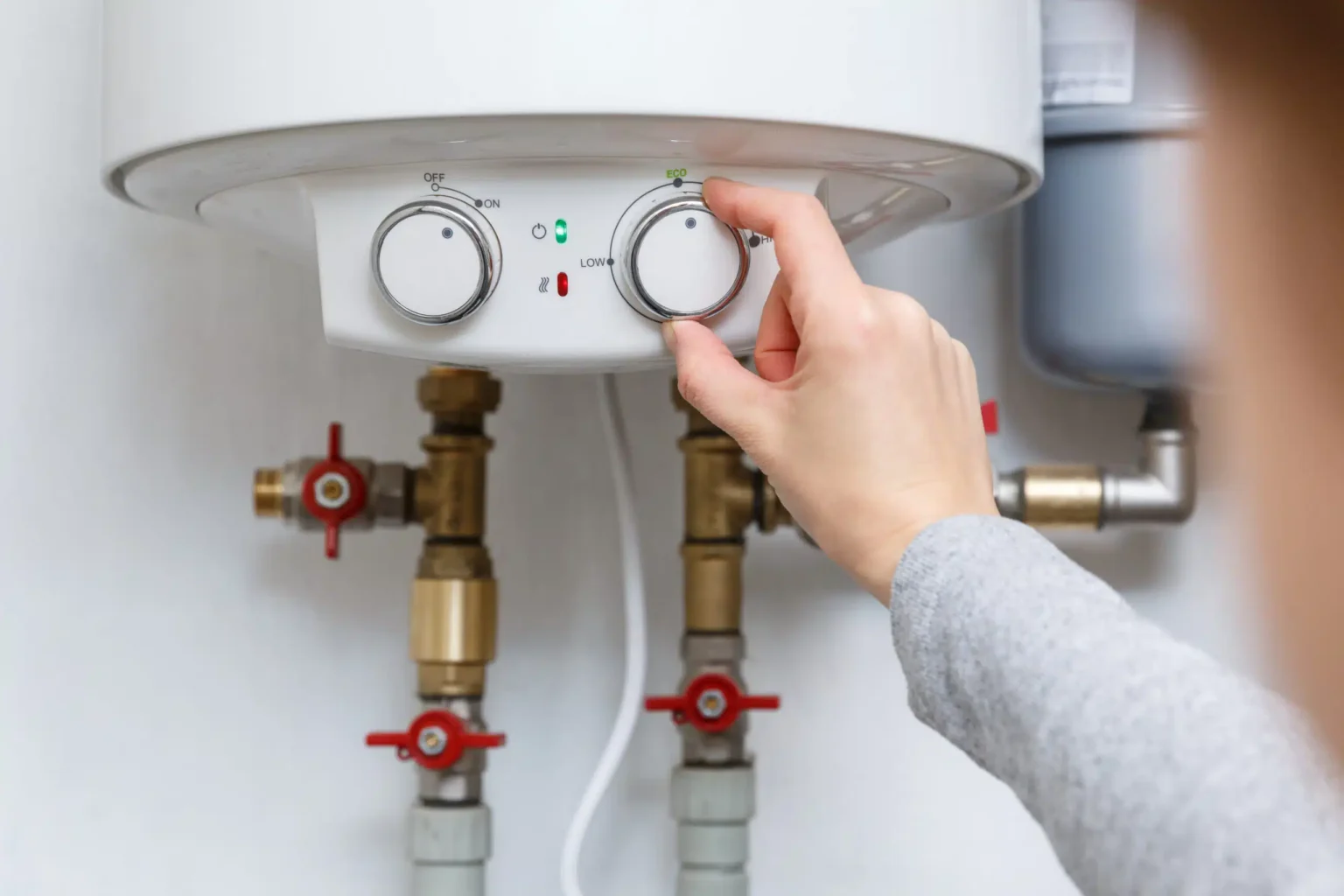 Technician adjusting a water heater in Dublin